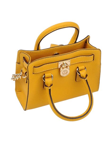 michael kors yellow shoulder bag|white michael kors crossbody.